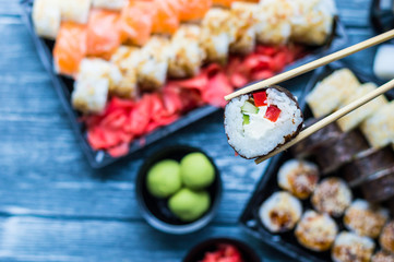 Sushi set: sushi roll with salmon and sushi roll with smoked eel, selective focus.