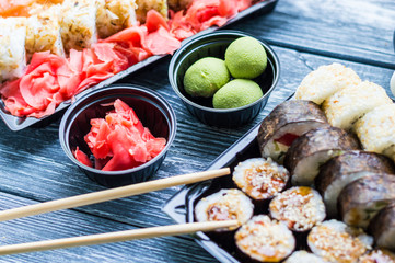 Sushi set: sushi roll with salmon and sushi roll with smoked eel, selective focus.