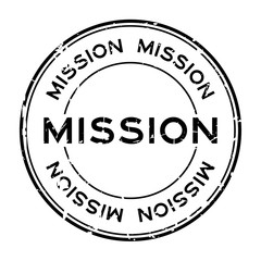 Grunge black mission word round rubber seal stamp on white background