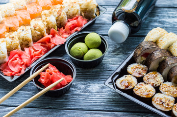 Sushi set: sushi roll with salmon and sushi roll with smoked eel, selective focus.