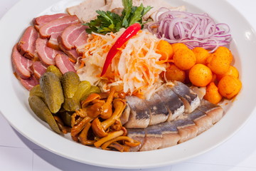 Plate with snacks for beer and herring