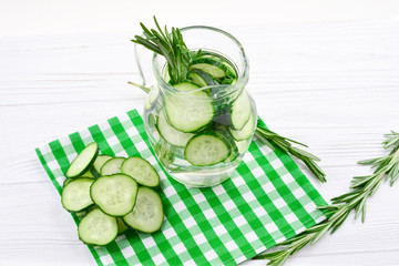 Cucumber and Rosemary Infused Water on wooden table