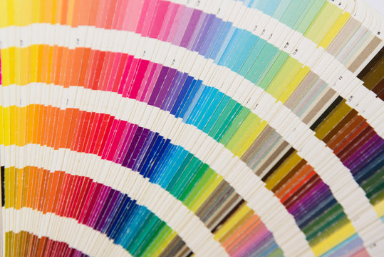 A used Fanned array of color printing swatches