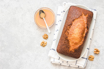 Gingerbread pound cake on light concrete background. Top view, space for text.