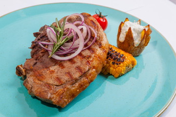 Steak on colored plate