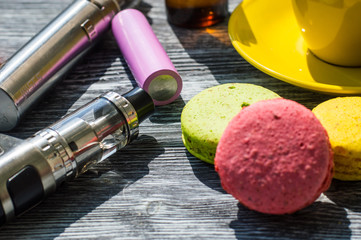 Still life with e-cig and jiuce on the wooden background