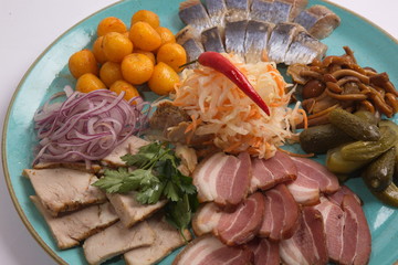 Plate with snacks for beer and herring