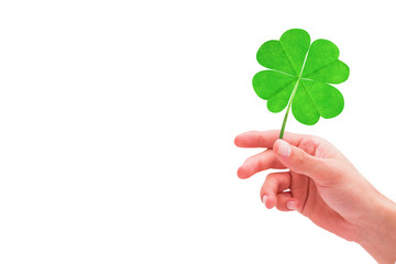 Shamrock against hand with raised fingers