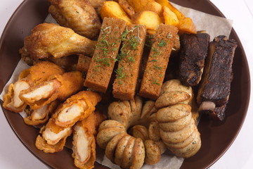 Grilled sausages on a plate with sauce