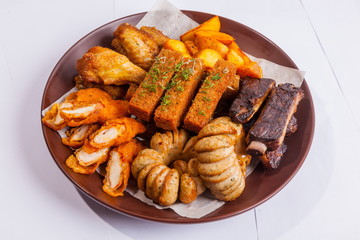 Grilled sausages on a plate with sauce