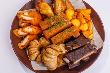 Grilled sausages on a plate with sauce