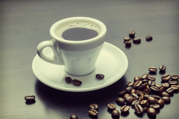 pile of coffee beans and a cup