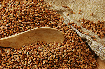 buckwheat groats and wooden spoon