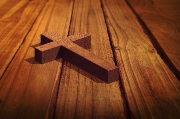 Wooden cross against high angle of wooden planks