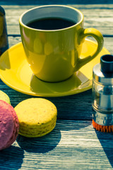 Still life with e-cig and jiuce on the wooden background