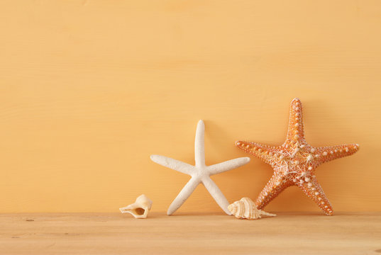 nautical, vacation and travel image with sea life style objects over wooden table.