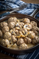 Delicious homemade swedish meatballs with mushroom cream sauce. Small depth of field.