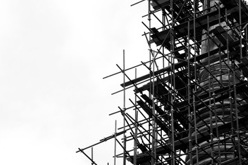 silhouette of scaffolding at the building - obrazy, fototapety, plakaty