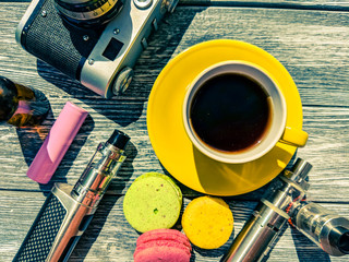 Still life with e-cig and jiuce on the wooden background