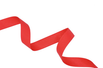 spiral of red fabric ribbon isolated on white background