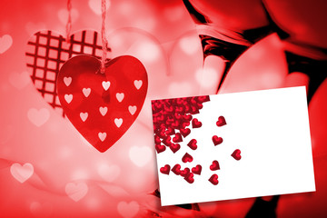 Red love hearts against white card