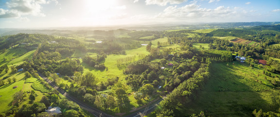 Aerial panorama of countryside with meadows and pastures at sunset in New South Wales, Australia