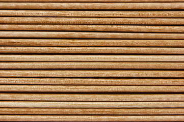 Wooden toothpicks are laid out in a number of