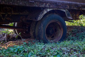 Aged truck rusted in abandoned mine.