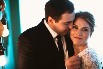 couple groom and bride in light studio