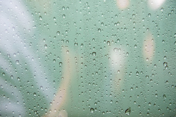 Selective focus at water drops on car glass,Rainy season