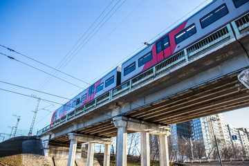 train moves on the bridge at sunset