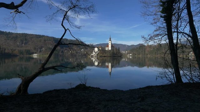 The Bled island seen from a lake shore