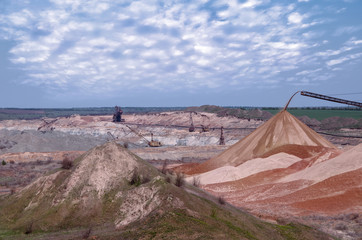 machines operate in a quarry for the extraction of manganese ore