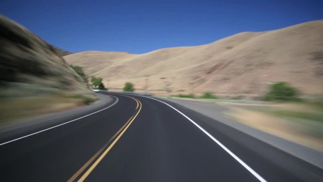 High-speed driver's POV of lonely Highway 20 near Harper, Oregon