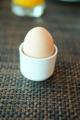 Soft-boiled egg in ceramic egg-cup