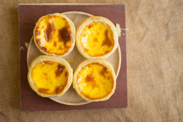 Close up of egg tarts on sack background
