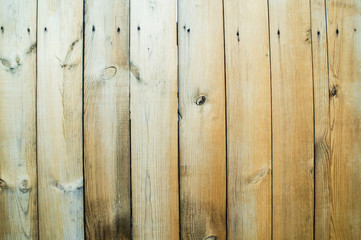 Obraz premium A fence made of unpainted boards