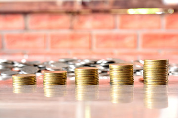 financial growth concept,with stack of coin,Brick wall background