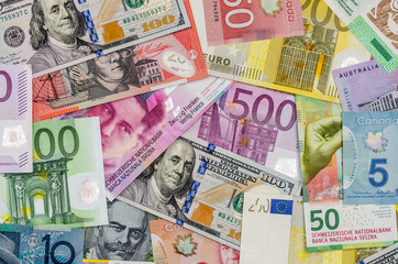 Fototapeta na wymiar American dollars, European euro, Swiss franc, Canadian dollar, australian dollar bills