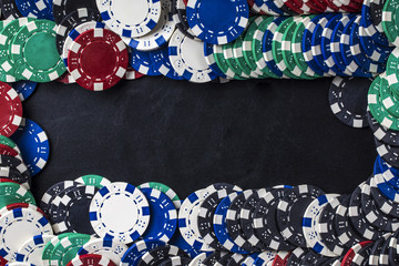 Fototapeta premium background of set of colored chips for playing poker with space for text