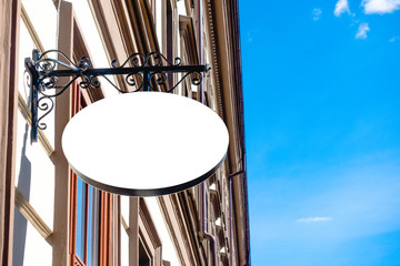 Mock up. Empty round signboard on classical architecture building.