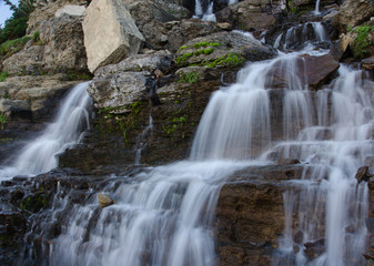 Fototapeta na wymiar waterfall with rocks at glacier national park