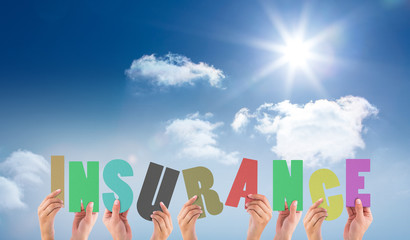 hands holding up insurance against bright blue sky with clouds