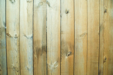 A fence made of unpainted boards