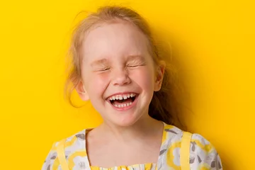 Fotobehang Cheerful girl laughs © tirlik