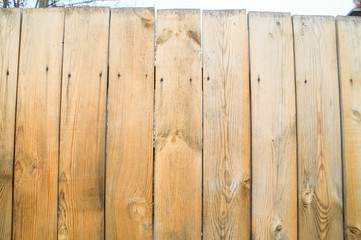 A fence made of unpainted boards