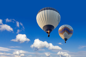 Two hot air balloons flying in sunsrise sky Cappadocia, Turkey, close-up, bottom