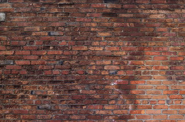 Old brick wall with ruined bricks