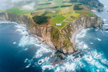 Aerial view of a lighthouse on a cliff