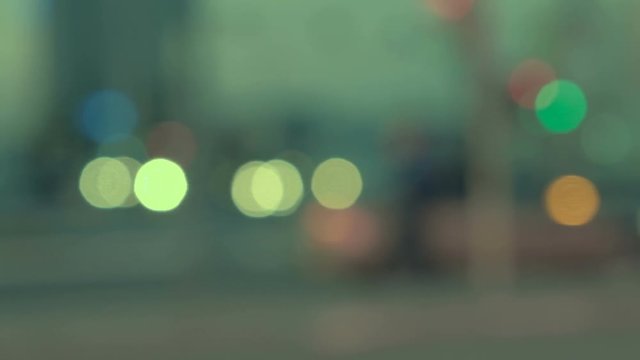 Out Of focus cars in a city at night.